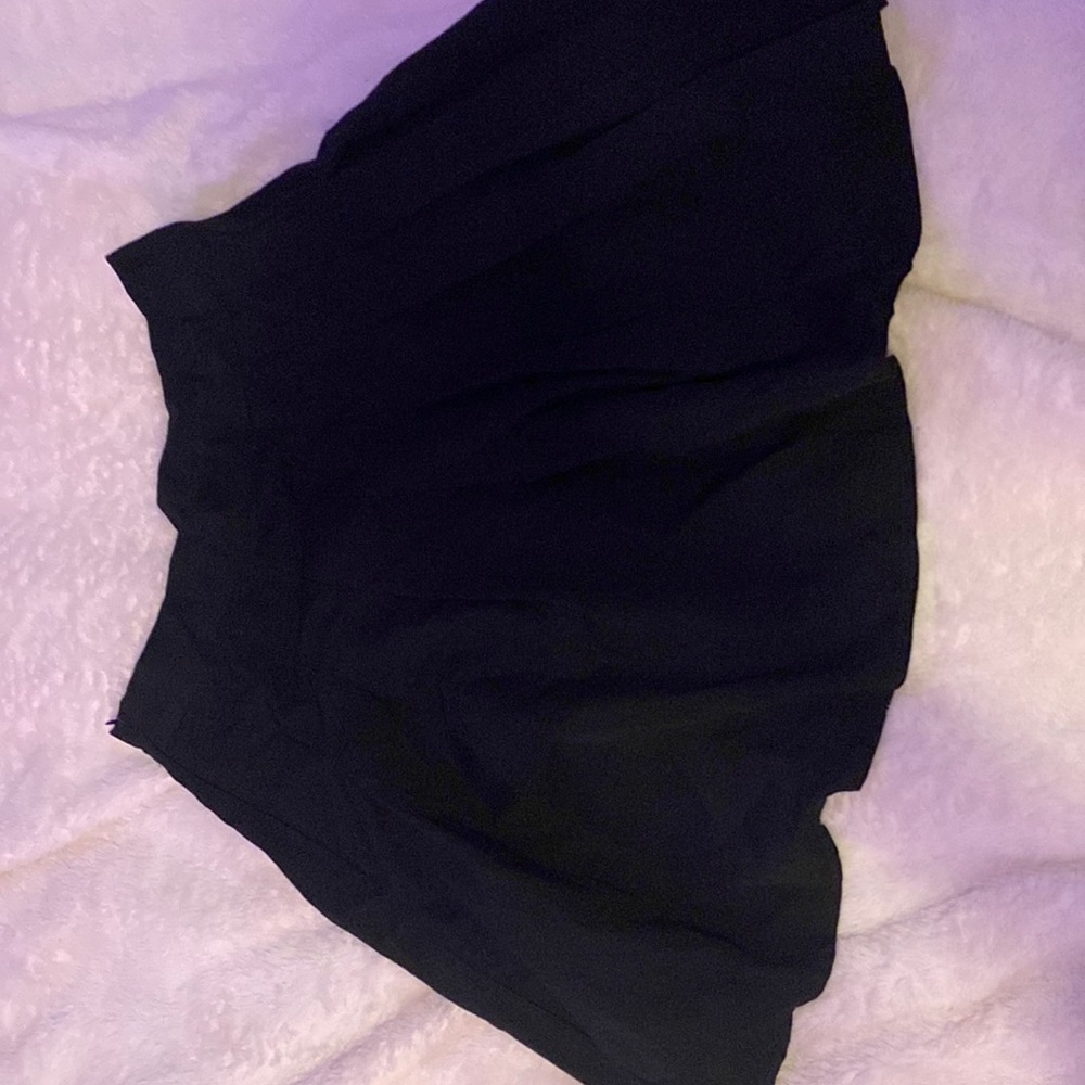 Woman’s black tennis skirt